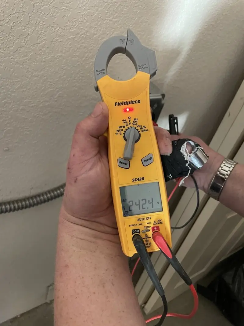 Voltage testing with clamp meter during Circuit Breaker Repair in Newark Valley